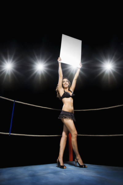 Ring girl holding sign in boxing ring. Date : 2008