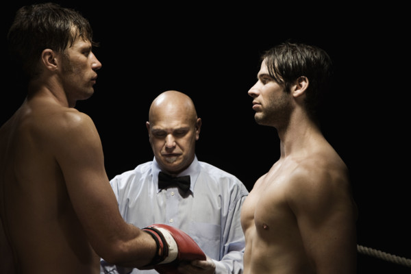 Referee checking boxer’s gloves. Date: 2008