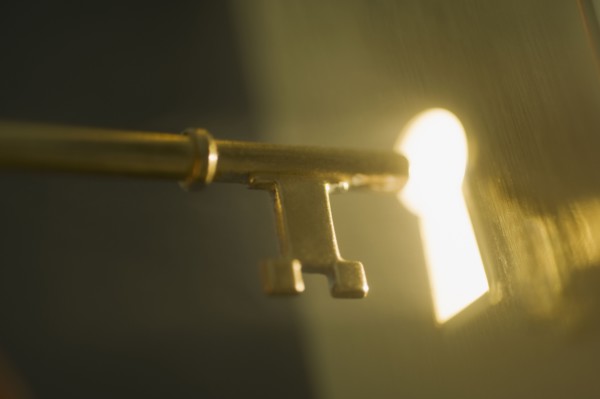 Close up of keyhole and key.