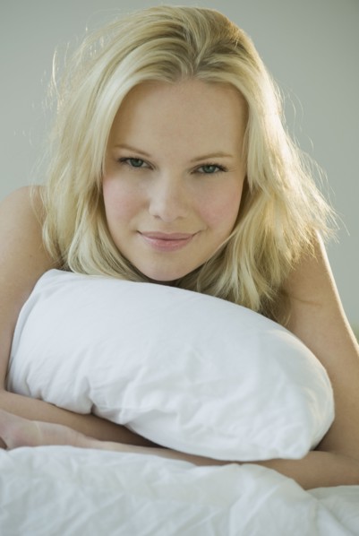 Woman relaxing on bed.