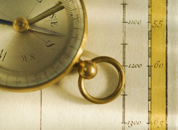 Close up of antique map and compass.