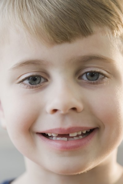 Portrait of boy with missing teeth.