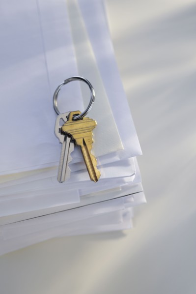 Keys on stack of mail.