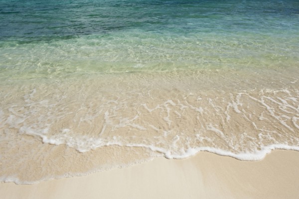 Beach and clear ocean water.