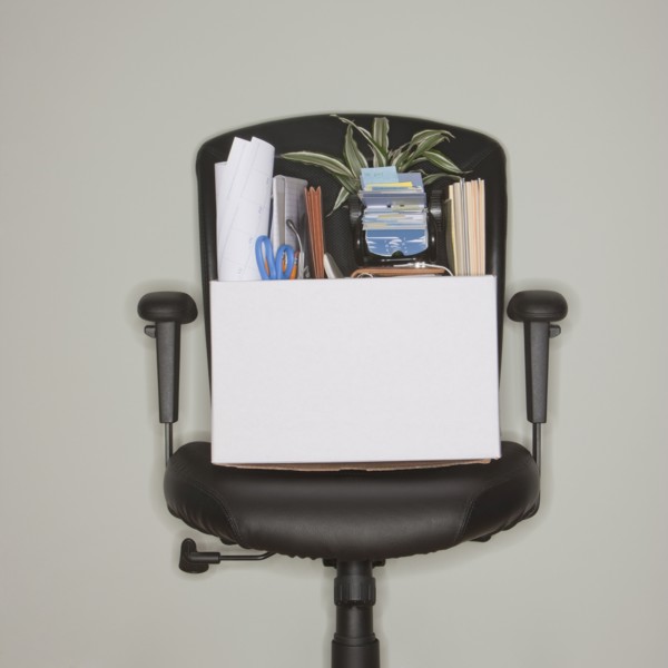 Packed box on office chair.