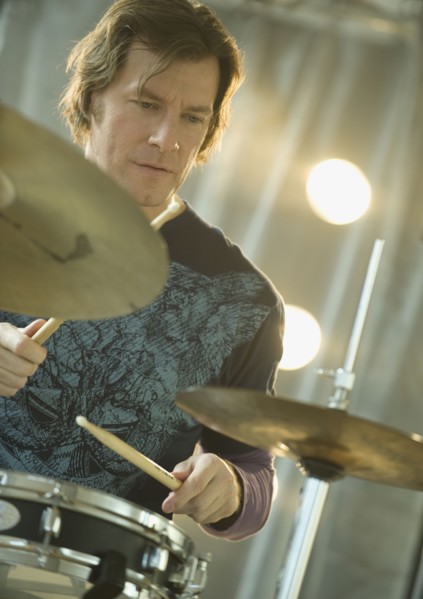 Man playing drums.