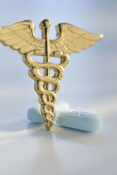 Prescription medicine and caduceus.