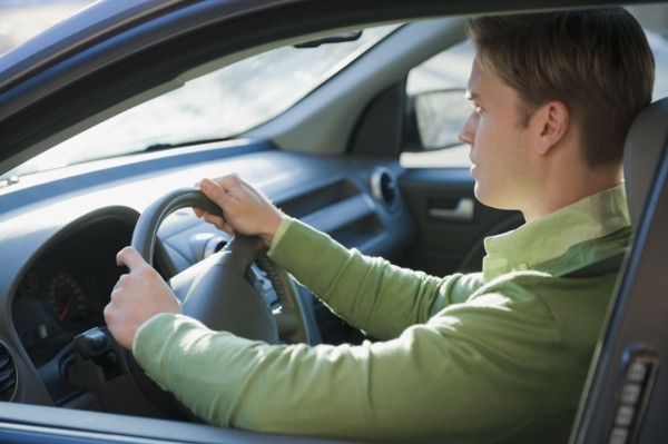 Man driving car.