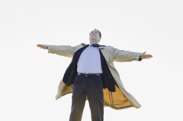 Businessman standing in wind. Photographe : PT Images
