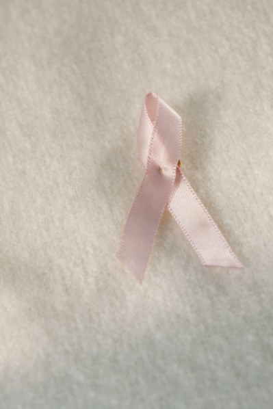 Close up of breast cancer ribbon.