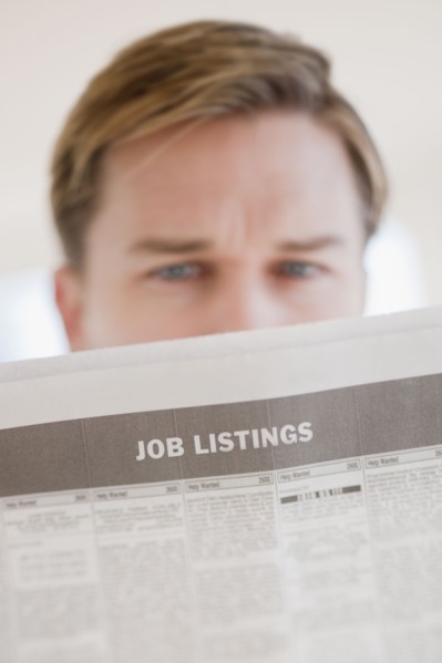 Man reading job listings.