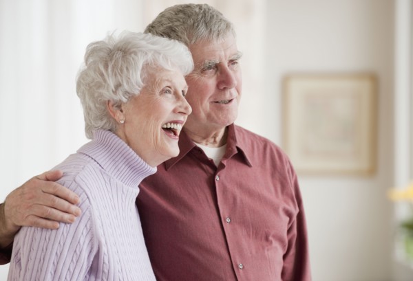 Senior couple hugging.