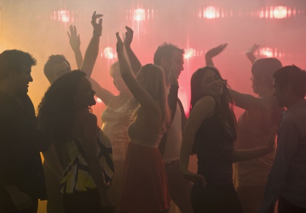 People dancing in nightclub.
