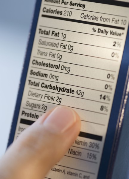 Man reading nutrition information.