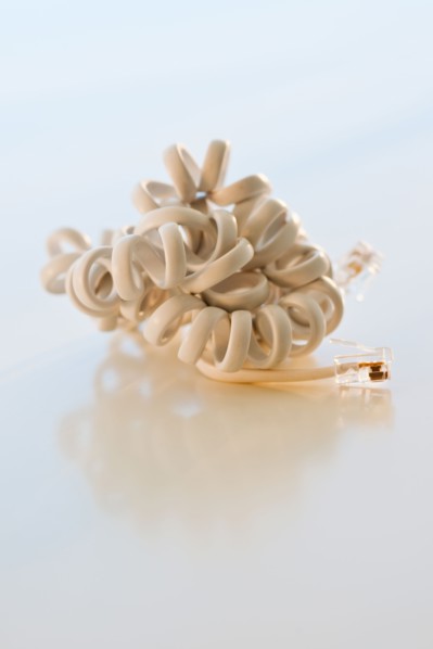 Studio shot of disconnected phone cord.