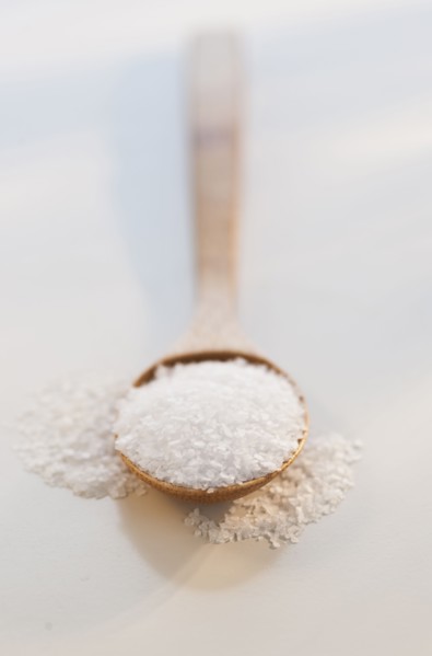 Wooden spoon of salt, studio shot.