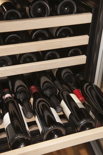 Wine bottles in wine cooler.