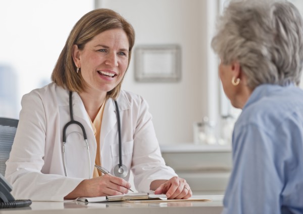 Senior woman talking with female doctor.