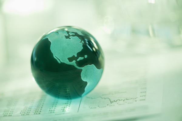 A globe on business papers.