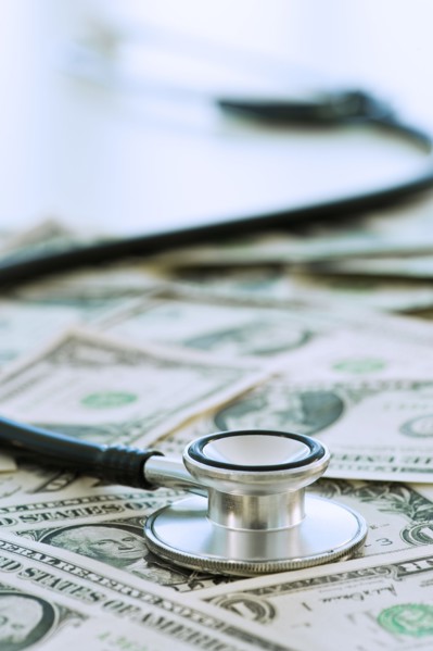 Stethoscope on bank notes