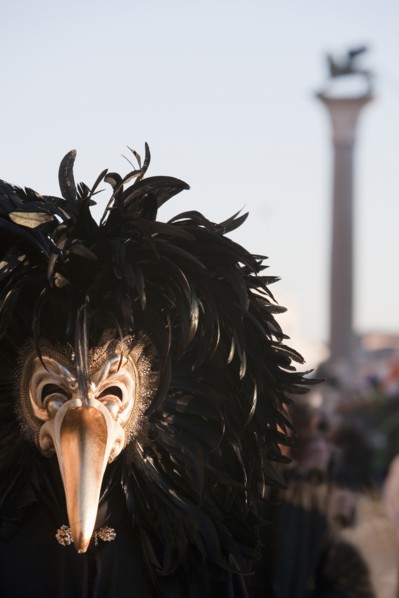 A person wearing a mask in in St. Mark's Square