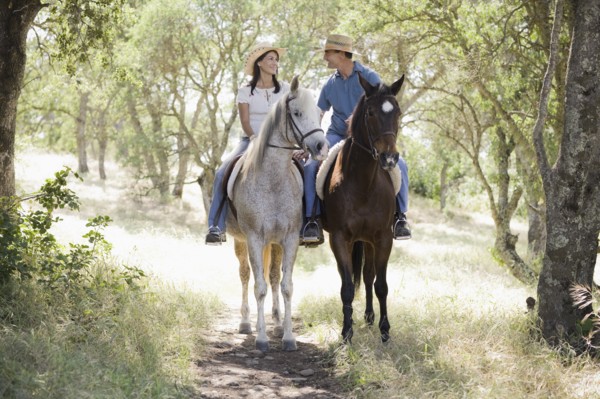 A couple riding horses