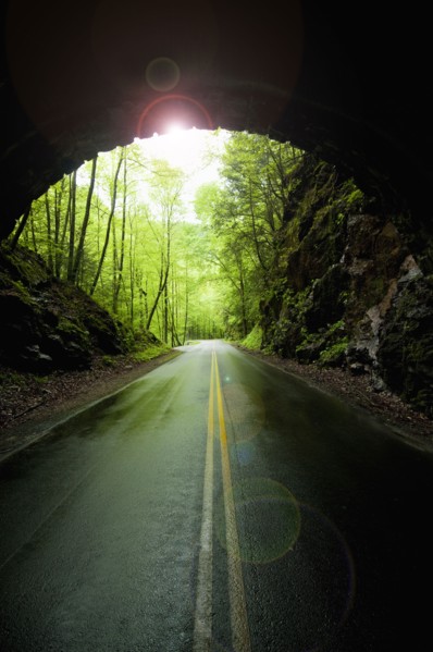 A scenic and empty road with tunnel