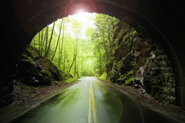 A scenic and empty road with tunnel