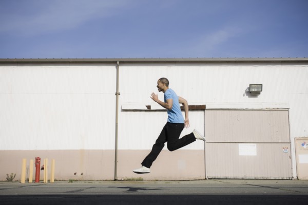 A man jumping on a road