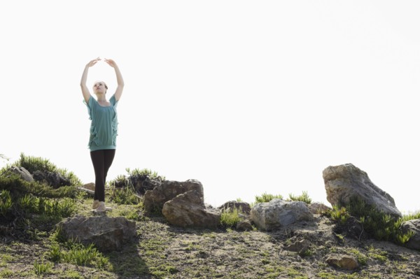 A woman dancing outdoors