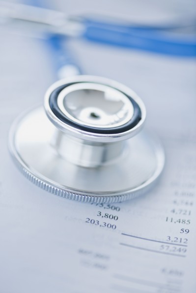 Stethoscope on finance papers.