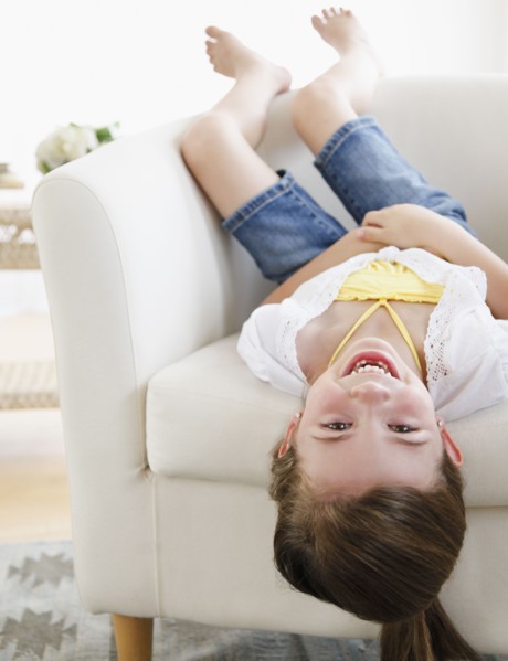 Child playing on sofa
