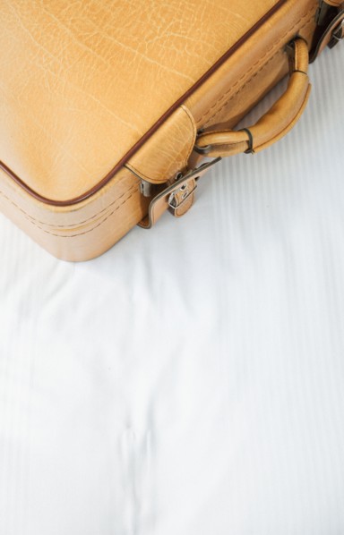 Suitcase on bed