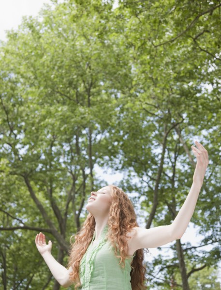 Woman under trees