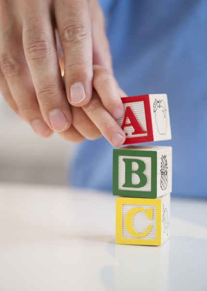 Child playing with ABC blocks.