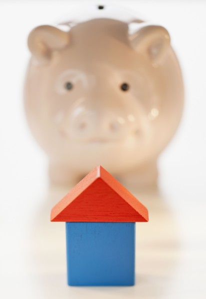 Piggy bank and symbolic house.