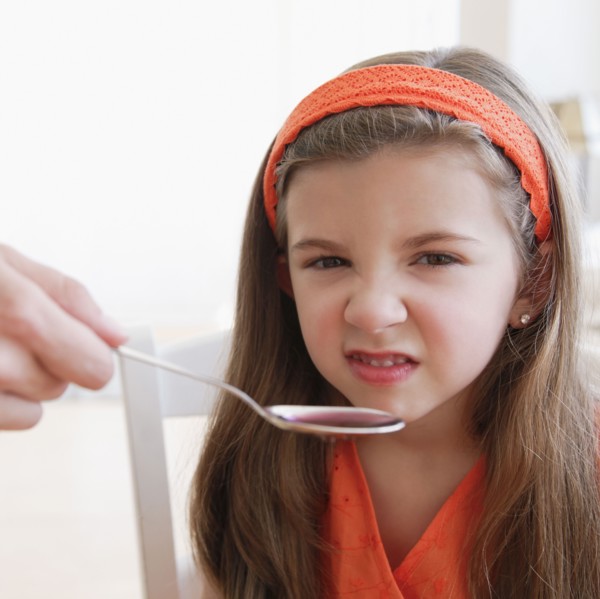 Child turning up nose to medicine