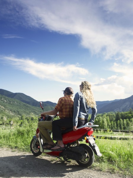 Young couple on scooter