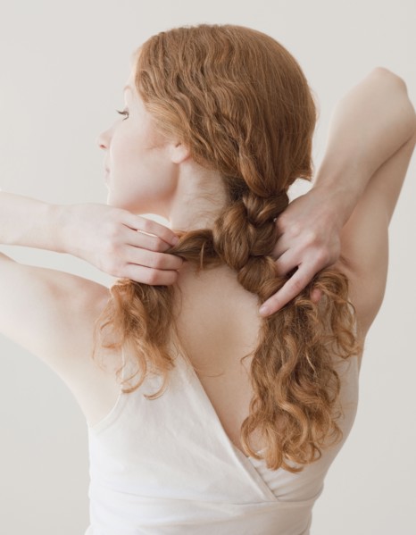 Woman fixing hair