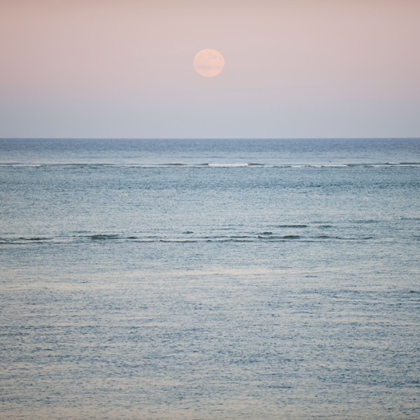 Moonrise over ocean.