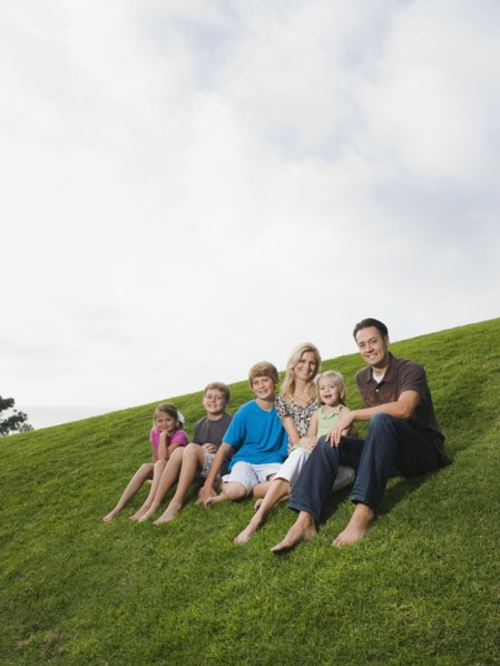 Family sitting on grass