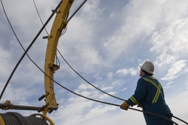 Man working with drilling equipment