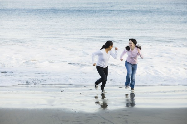 Girls running on beach
