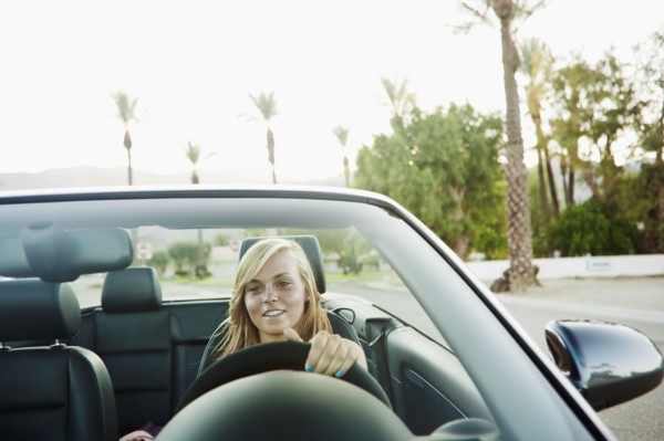 Woman driving convertible