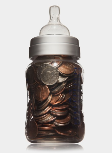 Baby bottle full of coins