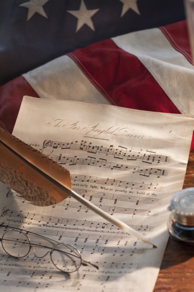 Sheet music on American flag.