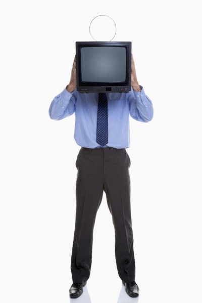 Man holding television in front of face