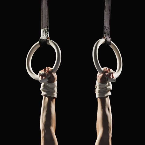 Gymnast swinging from rings