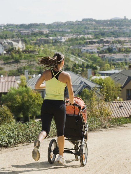 Woman jogging with stroller