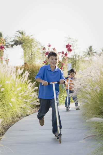 Children riding scooters